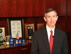 Photo of Dana Brown, Director of the Federal Air Marshals, and his awards