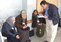 Photo of: An observer ensuring a free and fair vote at the Jabalia polling station 