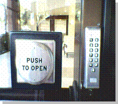 Photo of accessible door, with extra large "Push to Open" button