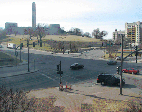 Figure 3 shows a four-leg signalized intersection.  Both of the intersecting roadways are four-lane arterials; one of the roadways has a raised median.