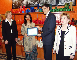 The U.S. Deputy Secretary of State for Management and Resources, Jacob J. Lew, handing over a grant document amounting to $100,256 to the President of Kashf Foundation, Roshaneh Zafar, to launch a microfinance program catering to rural women.
