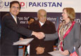 USAID Pakistan Mission Director Anne Aarnes and Additional Secretary, Ministry of Special Initiatives, Shafqat Hussain Naghmi shake hands after signing a Memorandum of Understanding to support the Pakistani Government’s Clean Drinking Water Project.