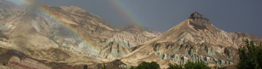Image of Sheep Rock and a rainbow.