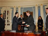 Volodymyr Makukha (left), Ukraine’s Minister of the Economy, and Drew Luten (right), USAID's Acting Assistant Administrator for Europe & Eurasia, congratulate one another upon the signing of the $45 million Millennium Challenge Corporation Threshold agreement