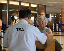 photo of a passenger showing her boarding pass at Phoenix Sky-Harbor International Airport