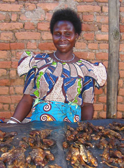 Suzie Cici sells smoked fish at a market in Yei, Southern Sudan.