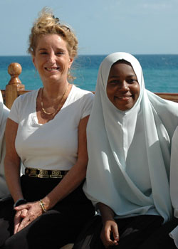 Tanzania’s USAID Mission Director Pamela White, left, and Fatma Kassim, take a break from activities at the USAID science camp in Lumumba.