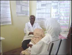 A woman and her child receive IMCI counseling from a trained practitioner.