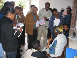 Journalists interview recipients of antiretroviral treatment (ART) during a visit to a local NGO.