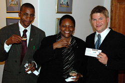 Dr. Jendayi Frazer, U.S. Ambassador
to South Africa, center, samples premium chèvre produced by Zama Goat Cheese.