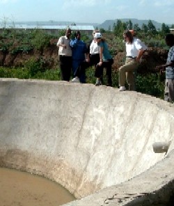 Photo of: 
 Farmers and concrete water structures that collect the rain