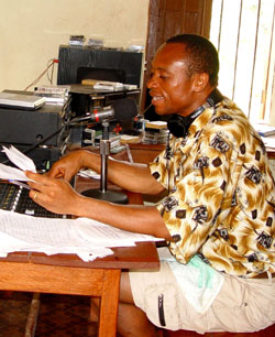 Photo of: A deejay announces the news for Radio Moa, a community radio station in a remote area of Sierra Leone.