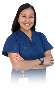 Nurse in blue scrub smiling