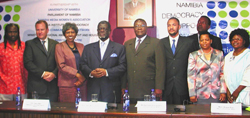 Board members of the Democracy Support Center, with U.S. Ambassador Joyce Barr, third from left, National Assembly Speaker Hon. Theo-Ben Gurirab, fourth from left, and National Council Chairman Hon. Asser Kapere, center.
