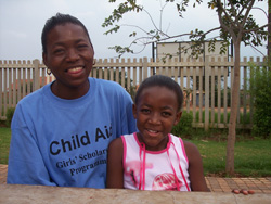 Zama, right, and her mentor Thoko meet each day after school in Gauteng Province.