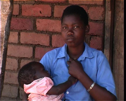 Carol Tambala stands with her daughter in the village of Mtelera, southern Malawi.