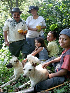 Jairo Palacios and his wife hold cacao that will be sold to provide for their children’s future.