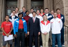 Gov. Perry Honors Texas Olympians Back Row (L to R): Aaron Peirsol, Trey Hardee, Garrett Weber-Gale, Kelley Hurley, Coach Kevin Mazeika, Middle Row (L to R): Eric Shanteau, Marshevet Hooker, Jeremy Wariner, Daniel McCormick, Jake Arrieta , Front Row (L to R): Leonel Manzano, Michelle Carter, GRP, Nancilea Foster, Mike Hazle