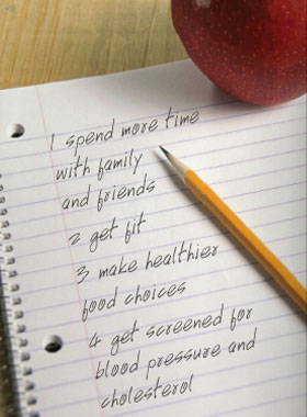 Pencil and paper with list of ways to stay healthy