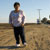 Photo: woman standing in field