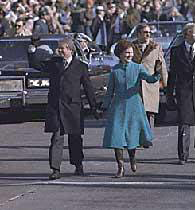 President and Mrs. Carter walk down Pennsylvania Avenue in Inaugural Parade, 1977.