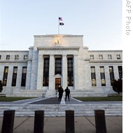 Officers of the U.S. Federal Reserve stand watch in front of the Fed building in Washington, D.C., 29 Oct 2008