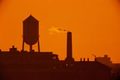 Emissions: The image representing this topic is photograph of smoke coming from a smokestack at sunset.