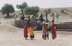 Residents fill up at a harvesting structure, which has made water readily available for drinking, agriculture and sanitation during the dry season.