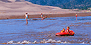 Children rafting Medano Creek