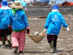 Women in Lhoong were employed to clear a field for cultivation under a cash-for-work program intended to help tsunami-affected communities recover.