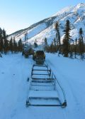 Picture of winter trail groomer pulled by snowmobile