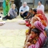 Ambassador Moriarty and Mrs. Lauren Kahea Moriarty observe a village organization meeting on  microfinance loans with the NGO BRAC in Sreepur.