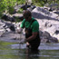 A researcher studying water quality in the park