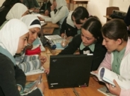 Photo of Jordanian youths working with a laptop