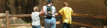 Image of kids on the trail with Dad