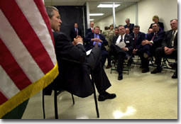 Pres. in chair talking to small group