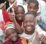 Namibian orphans and vulner-able children like these receive meals and tutoring from the USAID-funded Multi-Purpose Center in Walvis Bay, which pro-vides support to people infected with and affected by HIV/AIDS