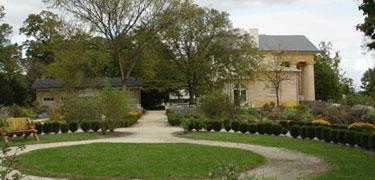 Photo of Arlington House, South Slave Quarters and Flower Garden