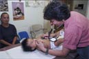 Clinician exams infant