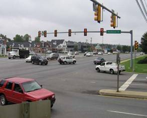 U-turn and RTOR vehicles are conflicting at the intersection of Woodbrook Drive.