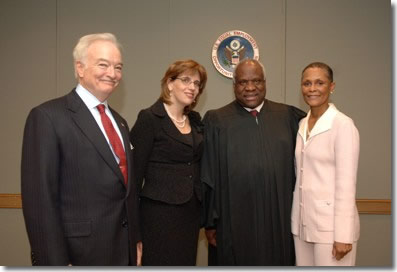 Pictured from left to right are Ronald S. Cooper, EEOC General Counsel;  Leslie E. Silverman, EEOC Vice Chair;  Clarence Thomas, Supreme Court Associate Justice, and Naomi C. Earp, EEOC Chair 