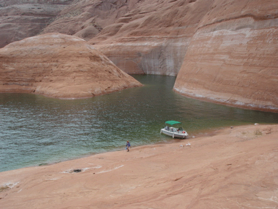 Boating and hiking in one of glen canyon's numerous side canyons
