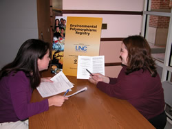 Two people reviewing forms