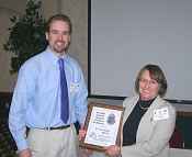 Justin W. Leonard award recipient Ellie Koon accepts the award from Michigan AFS Chapter President Todd Wills, during a recent combined meeting of the Michigan, Illinois, and Indiana chapters of the American Fisheries Society.
- Photo by Robert Stuber, U.S. Forest Service. 