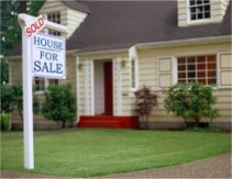 House with sold sign on front yard