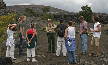 Master Volunteer Ranger Ed Bonsey leads a group of visitors on a hike to explore the park's geologic features
