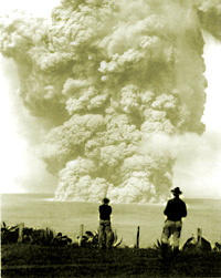 two men gaze at the 1924 eruption in Halemaumau from the caldera's edge.