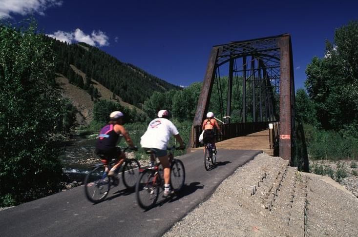 image of three bikers crossing a bridge, Upper Snake River District, ID 