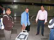 Marc Weitzel is greated by Martin Vargas, Director General of SEMARNAT's wildlife agency, and other government officials at the Mexico City Airport, birds in tow. (photo: Lopez, 2009) 