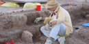 Scientist uncovers fossils at the Pig Dig